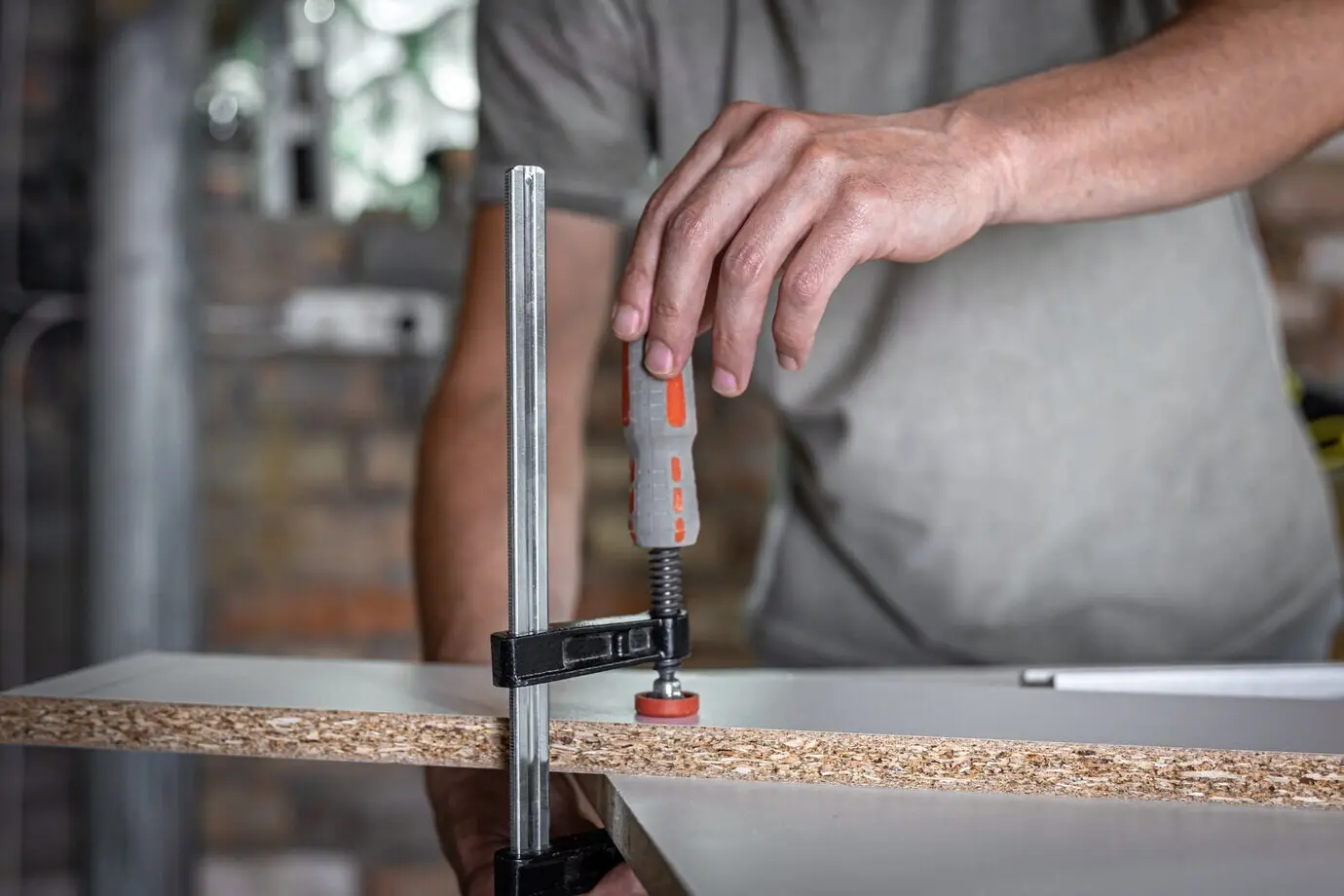 A carpentry tool—a carpentry clamp—representing a construction or carpentry concept.